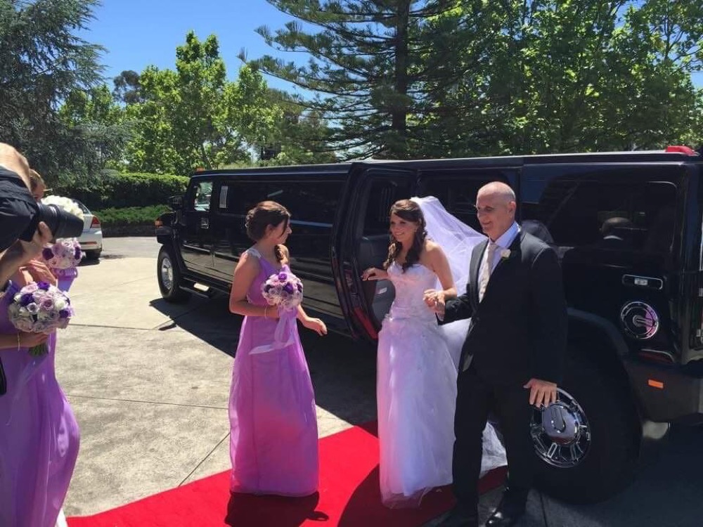 Red carpet roll-out at a wedding